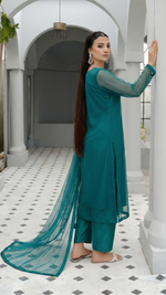 ROZAIB Peacock Green luxury Bareeze net stitched suit. This premium ready to wear stitched dress features Optical Spine Architecture for a perfect vertical fall, 0.3mm micro-jali net texture, and master-tailored straight silhouette. A minimalist 3-piece stitched suit for women in a rich jewel tone, paired with raw silk loose shalwar and a matching Bareeze net dupatta. Designed for a high-end festive-formal look with zero embroidery.