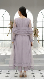 ROZAIB Lavender Grey luxury Bareeze net soft panel stitched suit. This premium ready to wear stitched dress features a 6-panel long frock silhouette with ultra-fine 0.3mm micro-mesh texture and master-tailored vertical panel lines. A minimalist 3-piece stitched suit for women in a cool muted lilac-grey tone, paired with raw silk cigarette trousers and an airy Bareeze net dupatta. Designed for a calm, sophisticated festive look with zero embroidery and precision stitching.