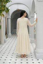 ROZAIB Ivory Cream luxury chiffon soft kalidaar stitched suit. This premium ready to wear stitched dress features a 12-panel radial construction, ultra-fine dry matte chiffon texture, and a graceful soft circular flare. A minimalist 3-piece stitched suit for women in a luminous warm ivory tone, designed for effortless festive elegance with zero embroidery and master-tailored invisible stitching.
