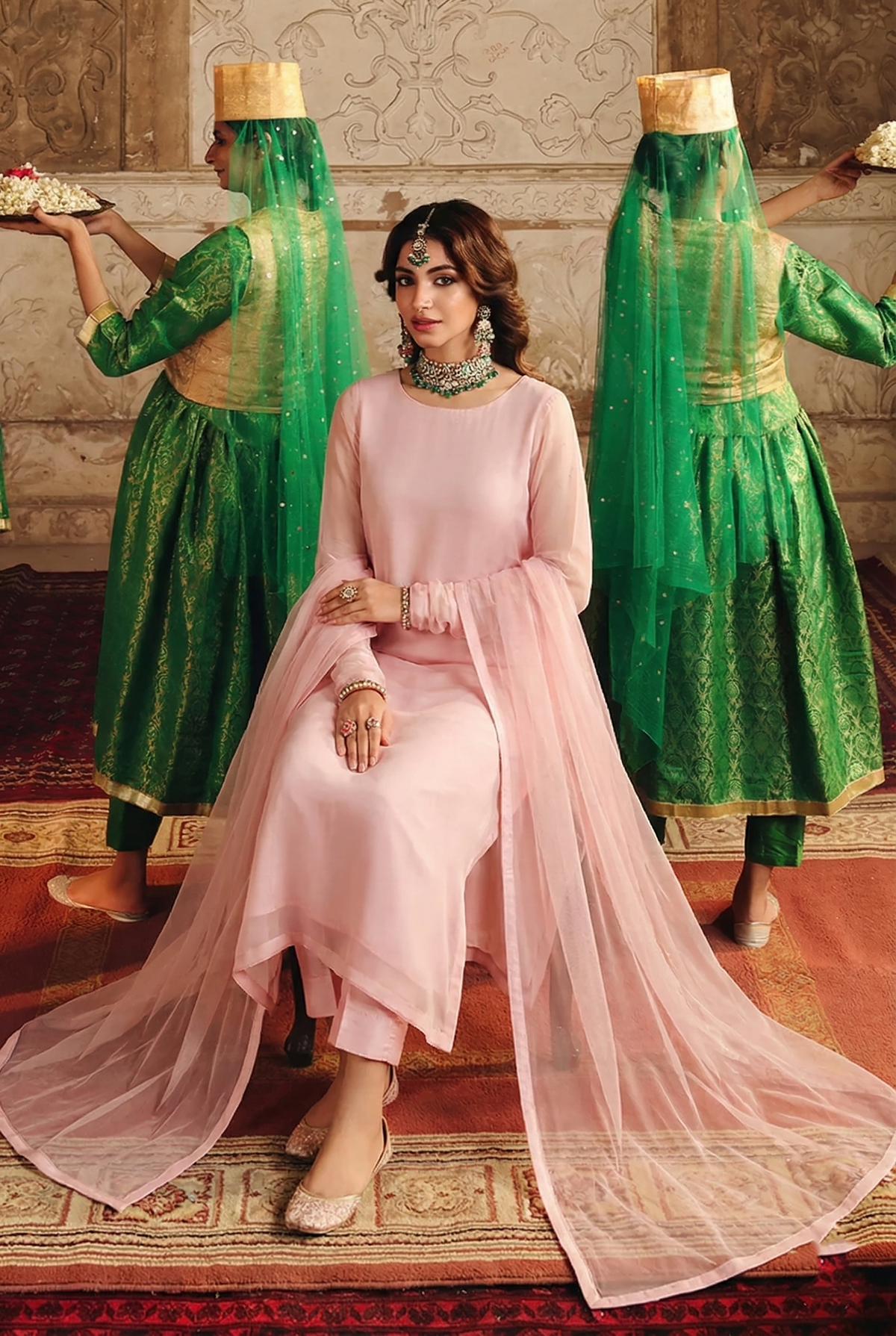 ROZAIB Pastel Pink minimal festive stitched suit in premium flowy chiffon fabric. This luxury ready to wear stitched dress features a straight relaxed flow fit with ultra-fine chiffon weave and a soft blush undertone. A minimalist 3-piece stitched suit for women designed for a fresh feminine look, paired with raw silk cigarette trousers and an airy Bareeze net dupatta. Perfect for spring-summer evening wear and formal events.