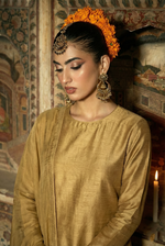 ROZAIB Antique Gold executive stitched suit in premium raw silk. This luxury ready to wear stitched dress features a straight tailored fit with authentic silk grain texture and master-tailored seams. A minimalist 3-piece stitched suit for women designed for a sophisticated heritage look, paired with raw silk cigarette pants and a fluid chiffon dupatta. Perfect for executive formal events and festive gatherings.