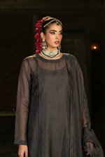 ROZAIB Anthracite Coal luxury organza stitched suit for women. A premium minimalist ready to wear stitched dress featuring floating spine architectural tailoring, paired with raw silk trousers and organza dupatta. Perfect for executive wear and festive formal gatherings.