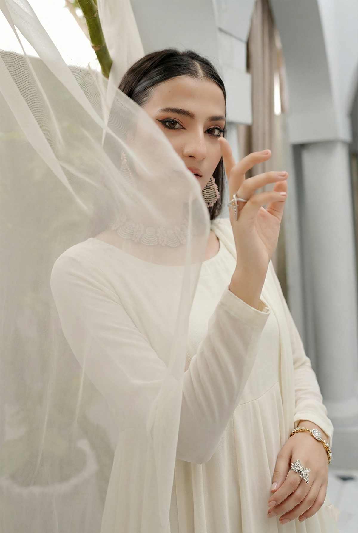 ROZAIB Ivory Cream luxury chiffon soft kalidaar stitched suit. This premium ready to wear stitched dress features a 12-panel radial construction, ultra-fine dry matte chiffon texture, and a graceful soft circular flare. A minimalist 3-piece stitched suit for women in a luminous warm ivory tone, designed for effortless festive elegance with zero embroidery and master-tailored invisible stitching.