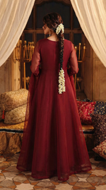 ROZAIB Deep Maroon luxury organza long frock stitched suit. This premium ready to wear stitched dress features a sophisticated light flare silhouette with 6-panel construction and sheer organza sleeves. A minimalist 3-piece stitched suit for women in a rich wine-red tone, paired with raw silk cigarette trousers and a lightweight Bareeze net dupatta. Designed for high-end festive evening wear with master-tailored pressed seams.