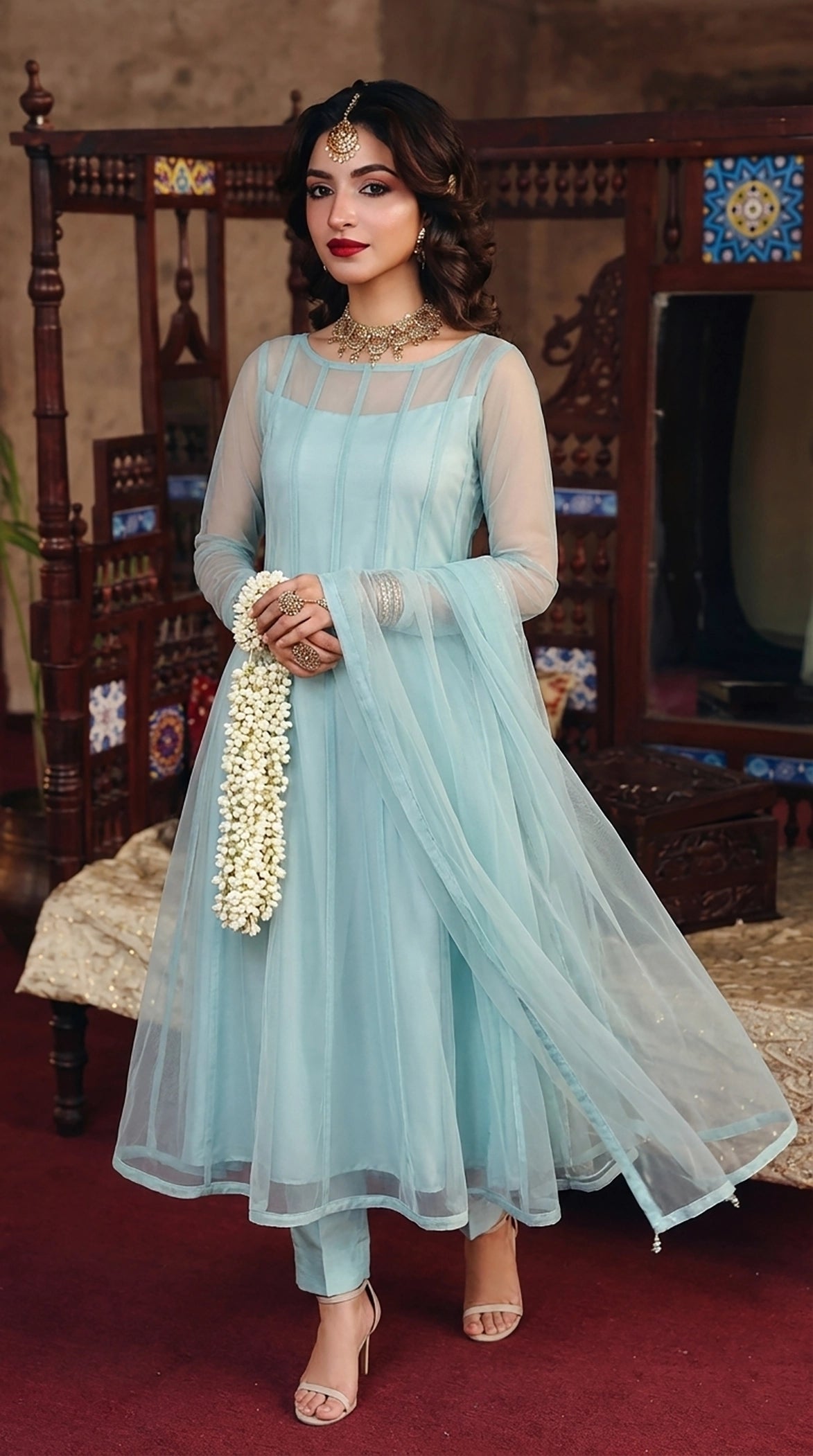 ROZAIB Aqua Mist luxury Bareeze net soft panel stitched suit. This premium ready to wear stitched dress features a sophisticated 6-panel vertical cut, ultra-fine micro-mesh texture, and master-tailored soft-release flare. A minimalist 3-piece stitched suit for women in a fresh airy pastel blue-green tone, paired with raw silk cigarette trousers and a matching Bareeze net dupatta. Designed for a calming luxury festive look with zero embroidery and precision stitching.