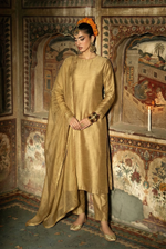ROZAIB Antique Gold executive stitched suit in premium raw silk. This luxury ready to wear stitched dress features a straight tailored fit with authentic silk grain texture and master-tailored seams. A minimalist 3-piece stitched suit for women designed for a sophisticated heritage look, paired with raw silk cigarette pants and a fluid chiffon dupatta. Perfect for executive formal events and festive gatherings.