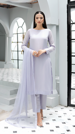 ROZAIB Ice Lilac luxury Bareeze net A-line stitched suit. This premium ready to wear stitched dress features a relaxed A-line fit, ultra-fine 0.3mm micro-mesh texture, and a clean boat neckline. A minimalist 3-piece stitched suit for women in a fresh icy lavender tone, paired with raw silk cigarette trousers and an airy Bareeze net dupatta. Designed for a calm, sophisticated festive look with zero embroidery and high-definition tailoring.
