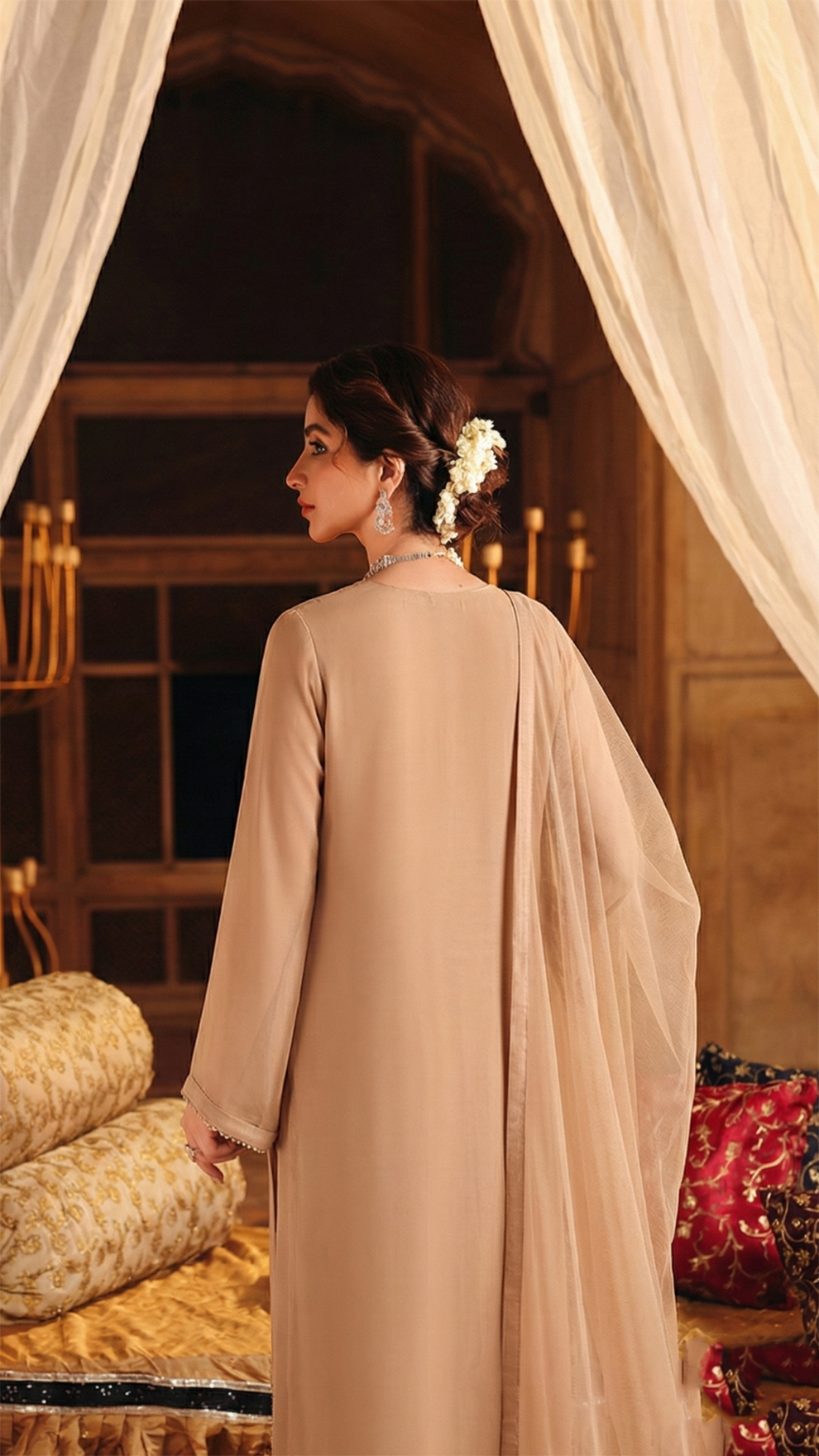 ROZAIB Nude Sand minimal festive stitched suit in premium flowy chiffon fabric. This luxury ready to wear stitched dress features a straight relaxed flow fit with ultra-fine micro chiffon grain and master-tailored vertical lines. A 3-piece stitched suit for women designed for effortless elegance, paired with raw silk cigarette trousers and a lightweight Bareeze net dupatta. Perfect for a sophisticated minimalist look in any season.