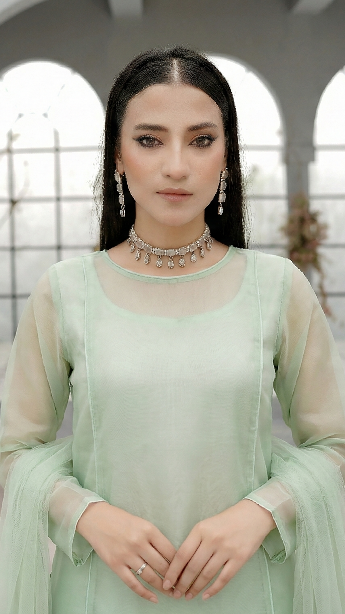ROZAIB Pastel Green luxury A-line organza stitched suit. This premium ready to wear stitched dress features a soft structured A-line fit, ultra-fine crisp organza weave, and a master-tailored round neckline with self-fabric piping detail. A minimalist 3-piece stitched suit for women in a fresh mint-neutral tone, paired with raw silk cigarette trousers and a lightweight Bareeze net dupatta. Perfect for spring-summer festive daywear with zero embroidery.