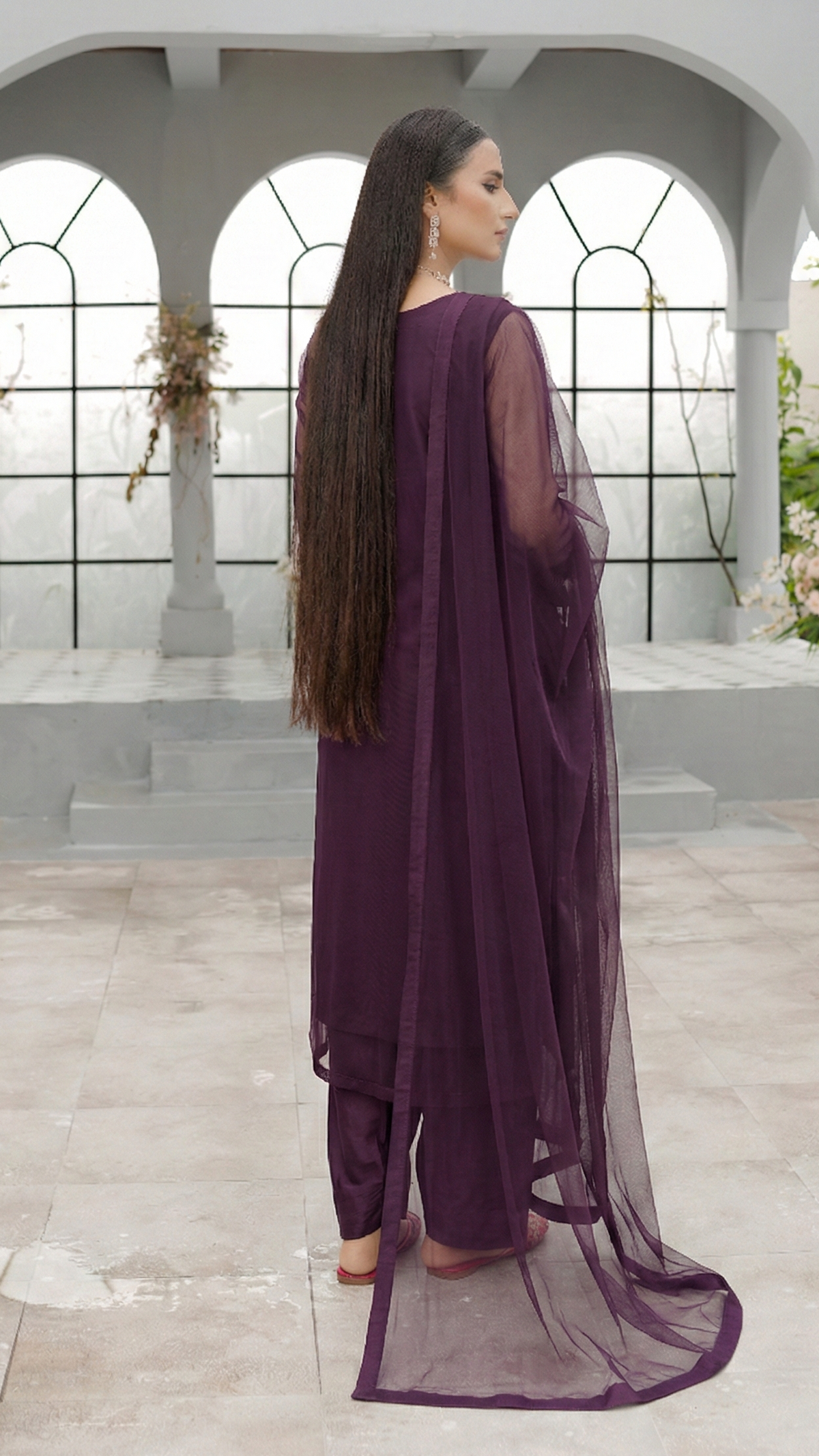 ROZAIB Eggplant luxury Bareeze net stitched suit for women. This premium ready to wear stitched dress features an architectural straight balance fit with 0.3mm micro-jali net texture and invisible frame construction. A minimalist 3-piece stitched suit in a deep violet-black eggplant tone, paired with raw silk loose shalwar and a matching Bareeze net dupatta. Designed for a rich, sophisticated evening look with zero embroidery.