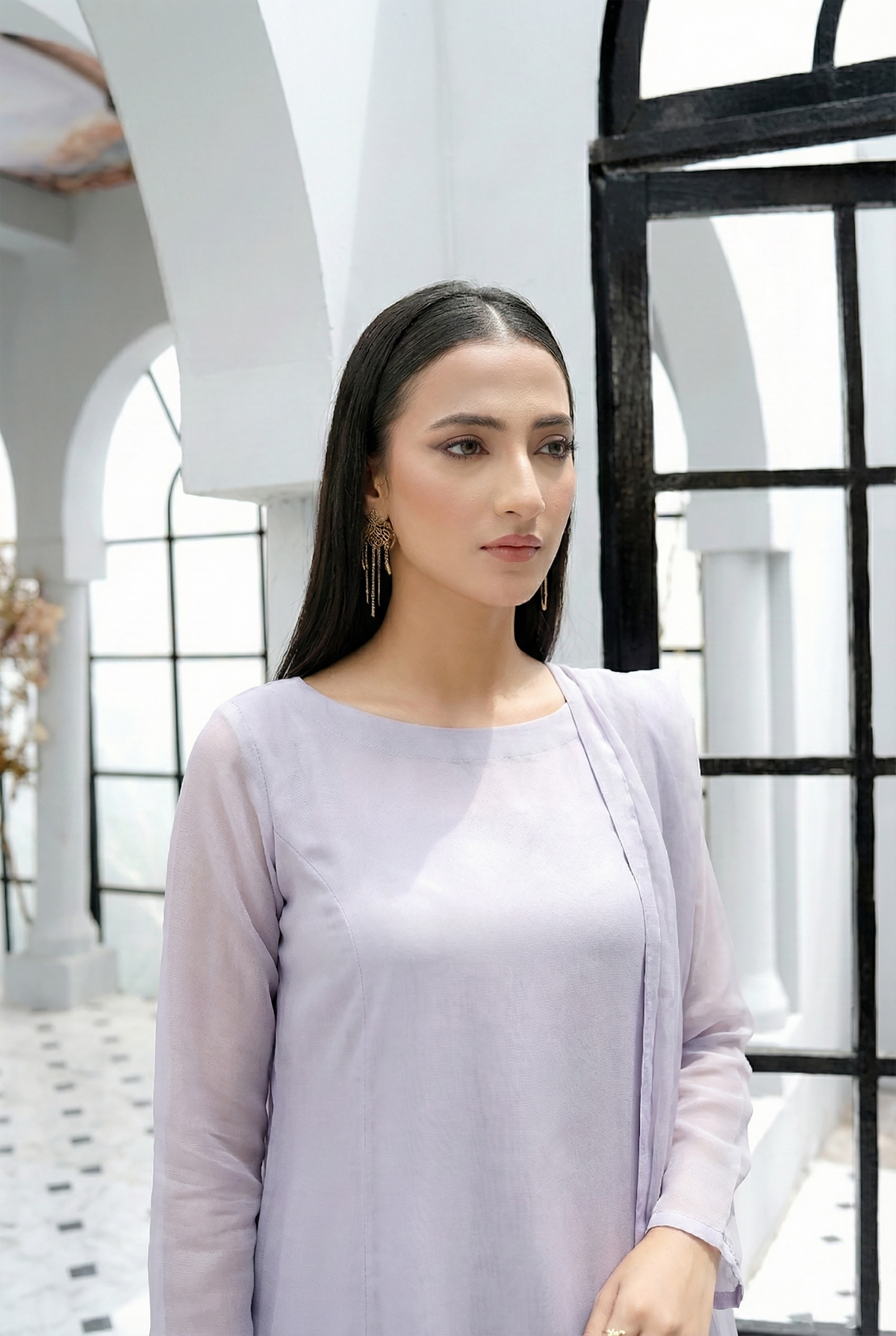 ROZAIB Ice Lilac luxury Bareeze net A-line stitched suit. This premium ready to wear stitched dress features a relaxed A-line fit, ultra-fine 0.3mm micro-mesh texture, and a clean boat neckline. A minimalist 3-piece stitched suit for women in a fresh icy lavender tone, paired with raw silk cigarette trousers and an airy Bareeze net dupatta. Designed for a calm, sophisticated festive look with zero embroidery and high-definition tailoring.