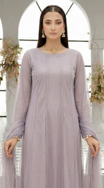 ROZAIB Lavender Grey luxury Bareeze net soft panel stitched suit. This premium ready to wear stitched dress features a 6-panel long frock silhouette with ultra-fine 0.3mm micro-mesh texture and master-tailored vertical panel lines. A minimalist 3-piece stitched suit for women in a cool muted lilac-grey tone, paired with raw silk cigarette trousers and an airy Bareeze net dupatta. Designed for a calm, sophisticated festive look with zero embroidery and precision stitching.