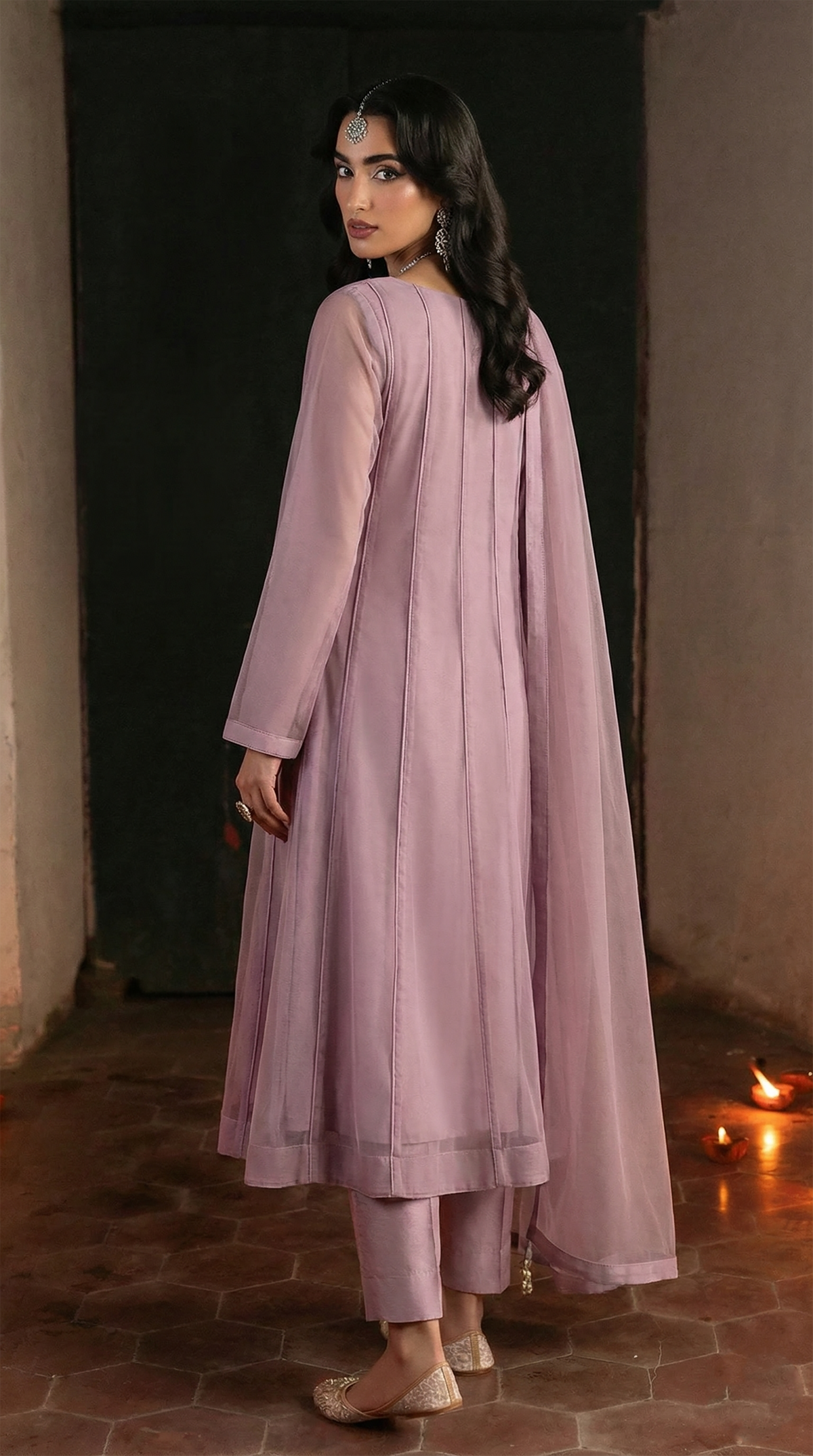 ROZAIB Mauve Lilac minimal kalidaar stitched suit in premium Bareeze net. This luxury ready to wear stitched dress features an 8-panel structured flow fit with ultra-fine micro-mesh texture and invisible seam junctions. A 3-piece stitched suit for women in a soft romantic pastel tone, paired with raw silk cigarette pants and an airy Bareeze net dupatta. Designed for a sophisticated festive look with zero embroidery.