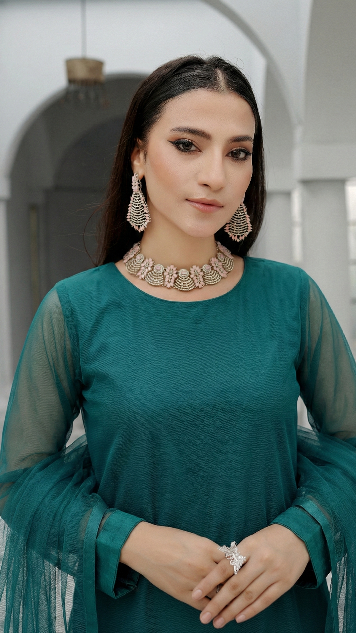 ROZAIB Peacock Green luxury Bareeze net stitched suit. This premium ready to wear stitched dress features Optical Spine Architecture for a perfect vertical fall, 0.3mm micro-jali net texture, and master-tailored straight silhouette. A minimalist 3-piece stitched suit for women in a rich jewel tone, paired with raw silk loose shalwar and a matching Bareeze net dupatta. Designed for a high-end festive-formal look with zero embroidery.