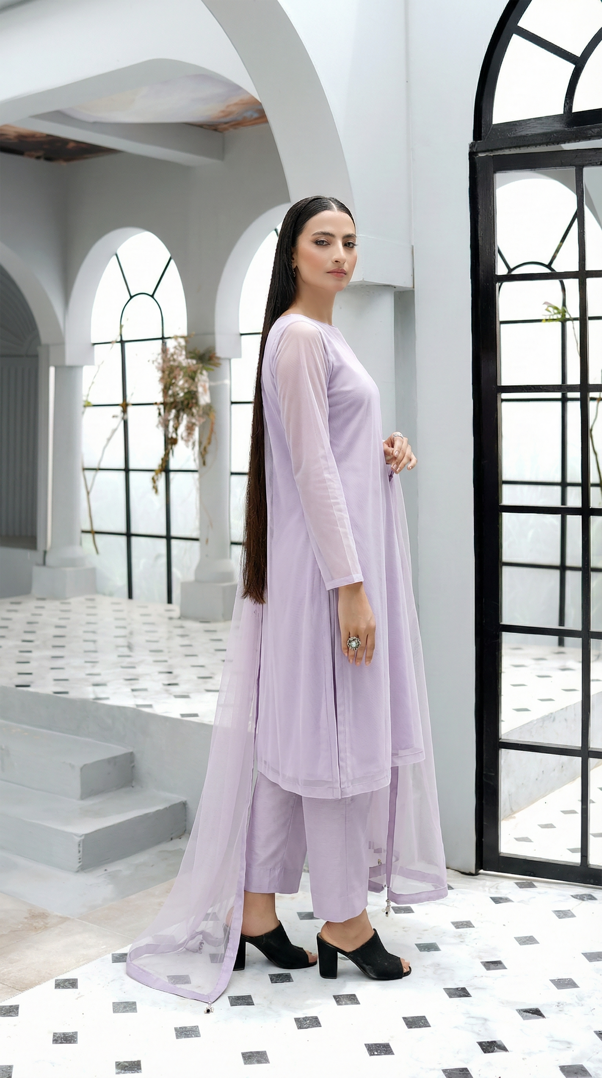 ROZAIB Ice Lilac luxury Bareeze net A-line stitched suit. This premium ready to wear stitched dress features a relaxed A-line fit, ultra-fine 0.3mm micro-mesh texture, and a clean boat neckline. A minimalist 3-piece stitched suit for women in a fresh icy lavender tone, paired with raw silk cigarette trousers and an airy Bareeze net dupatta. Designed for a calm, sophisticated festive look with zero embroidery and high-definition tailoring.