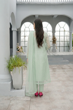 ROZAIB Pastel Green luxury A-line organza stitched suit. This premium ready to wear stitched dress features a soft structured A-line fit, ultra-fine crisp organza weave, and a master-tailored round neckline with self-fabric piping detail. A minimalist 3-piece stitched suit for women in a fresh mint-neutral tone, paired with raw silk cigarette trousers and a lightweight Bareeze net dupatta. Perfect for spring-summer festive daywear with zero embroidery.