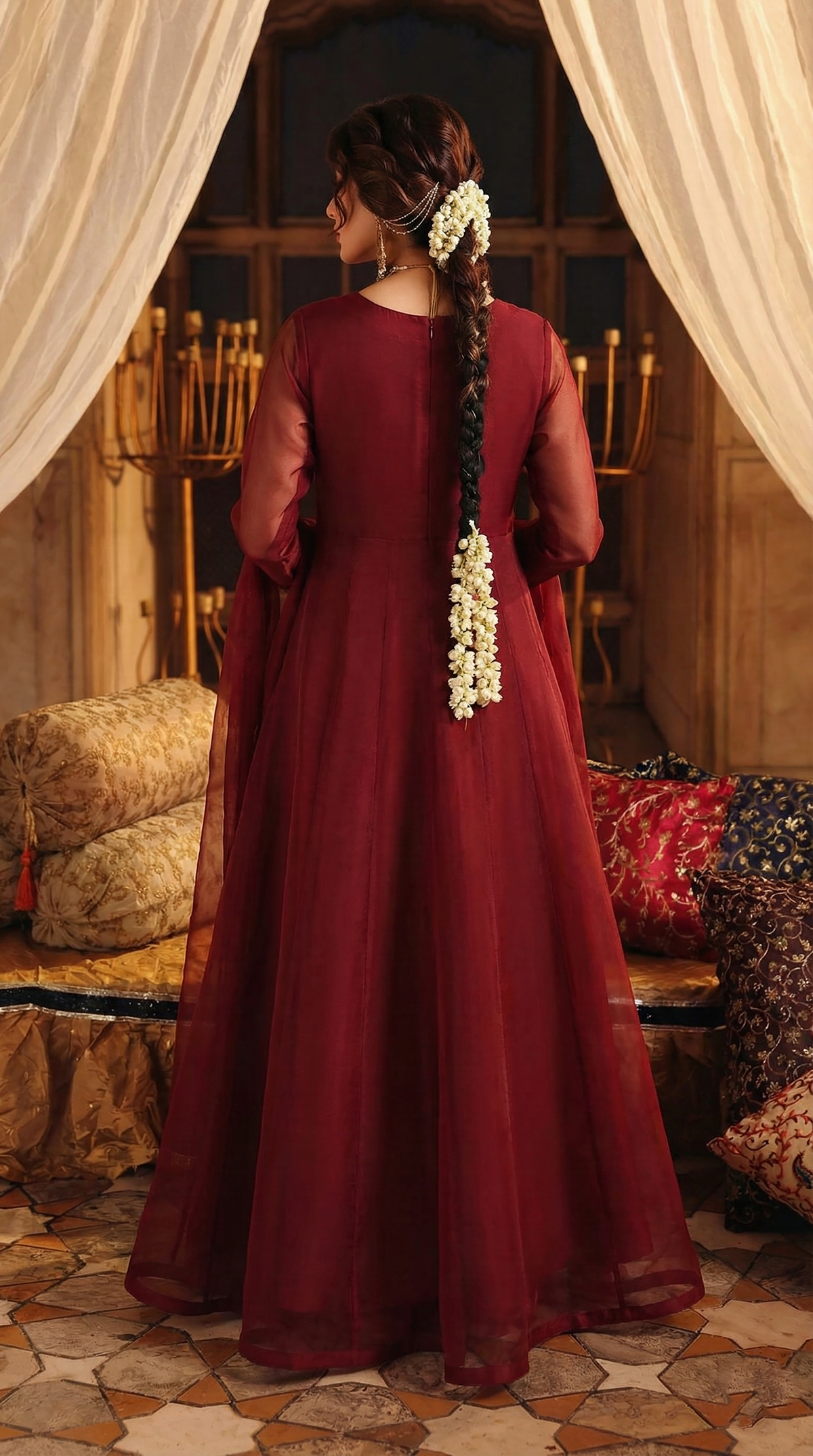 ROZAIB Deep Maroon luxury organza long frock stitched suit. This premium ready to wear stitched dress features a sophisticated light flare silhouette with 6-panel construction and sheer organza sleeves. A minimalist 3-piece stitched suit for women in a rich wine-red tone, paired with raw silk cigarette trousers and a lightweight Bareeze net dupatta. Designed for high-end festive evening wear with master-tailored pressed seams.