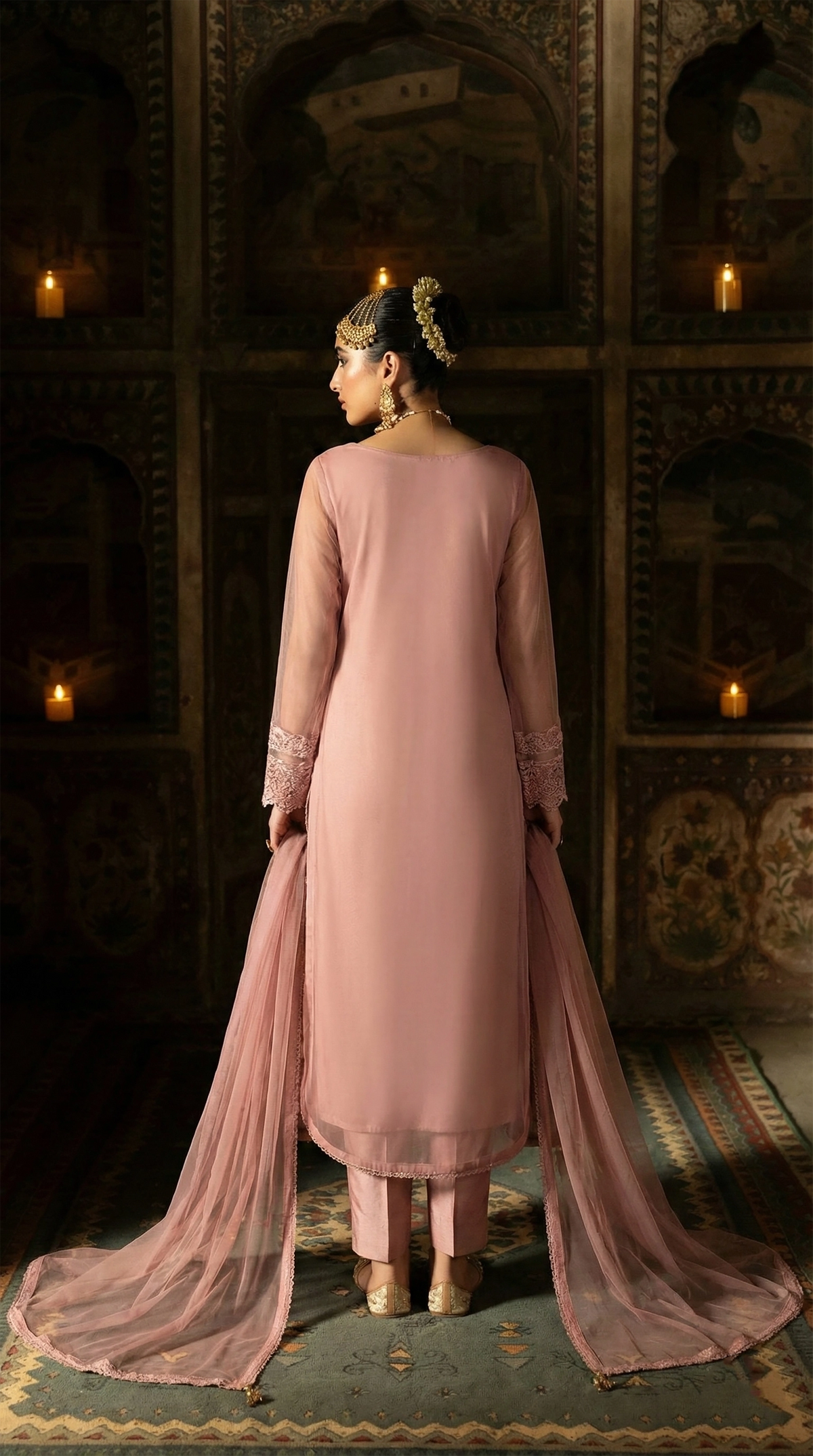 ROZAIB Dusty Pink luxury Bareeze net long shirt stitched suit. This premium ready to wear stitched dress features a modern rounded hem design, ultra-fine 0.3mm micro-net texture, and master-tailored straight sleeves with fine lace detailing. A minimalist 3-piece stitched suit for women in a muted pastel rose tone, paired with raw silk cigarette trousers and an airy Bareeze net dupatta. Perfect for a sophisticated festive look with high-definition tailoring.