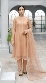 ROZAIB Champagne Peach luxury Bareeze net minimal kalidaar stitched suit. This premium ready to wear stitched dress features a 12-kali graceful flow fit, ultra-fine 0.3mm micro-mesh texture, and master-tailored vertical kali joints. A minimalist 3-piece stitched suit for women in a warm champagne-peach tone, paired with raw silk cigarette trousers and an airy Bareeze net dupatta. Designed for a traditional yet modern festive look with zero embroidery.