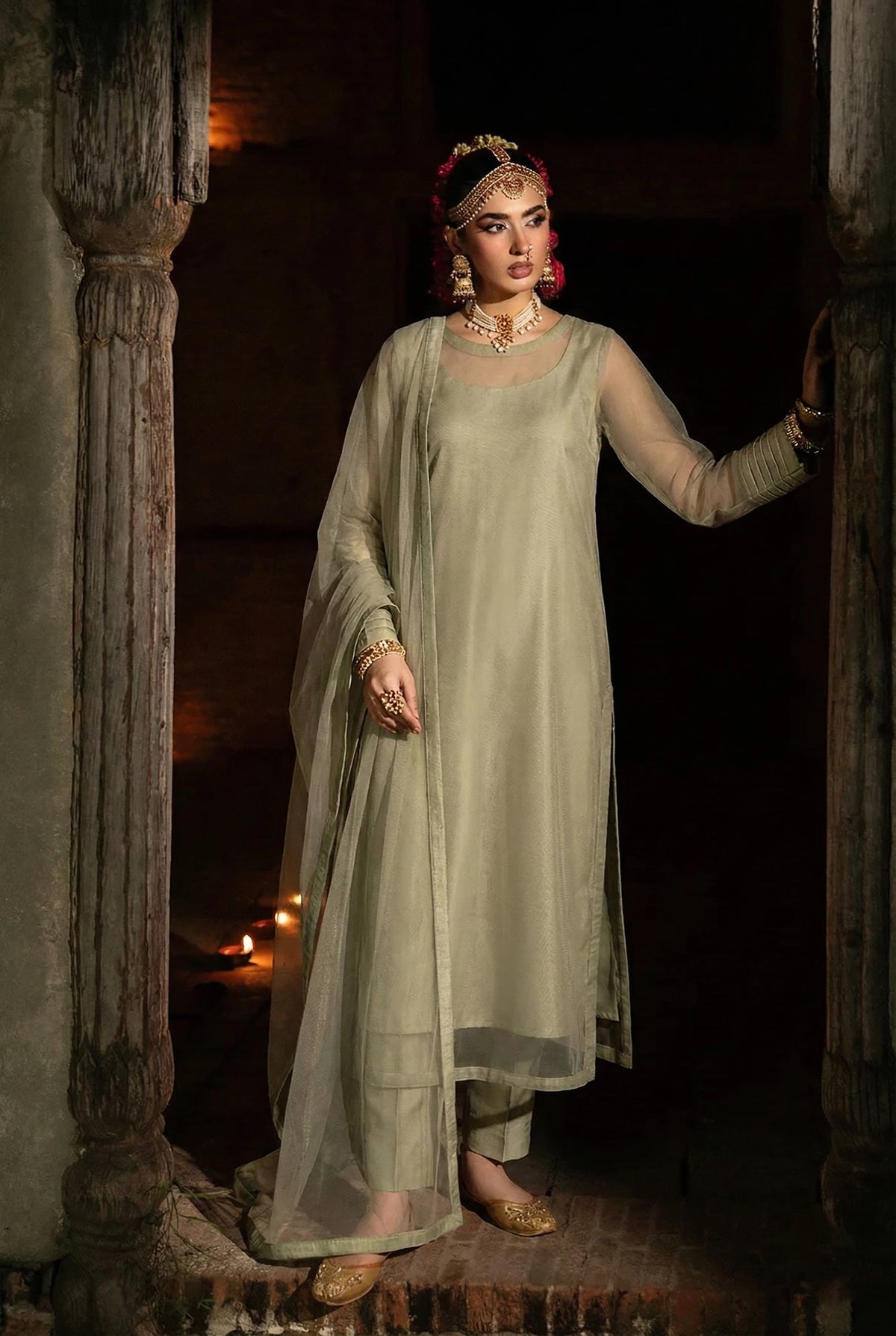 ROZAIB Olive Mist luxury Bareeze net long straight kurta stitched suit. This premium ready to wear stitched dress features unique structured cuff-stitch detailing, ultra-fine micro-mesh fabric, and master-tailored vertical seams. A minimalist 3-piece stitched suit for women in a muted earthy olive tone, paired with raw silk cigarette trousers and a lightweight Bareeze net dupatta. Designed for a calm and sophisticated festive look with zero embroidery.